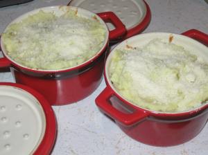Top with mashed potato mixture, sprinkle with Parmesan cheese