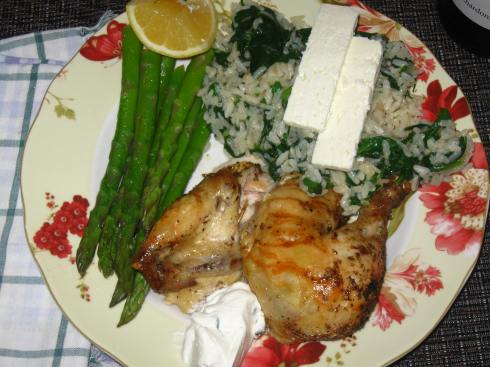 Greek-style Roasted Chicken with Spanakorizo, asparagus and Tzatziki sauce.