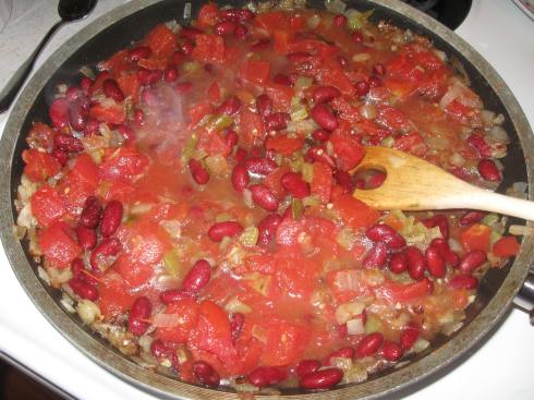 Add tomatoes, green chiles and kidney beans. Boil to reduce liquid.